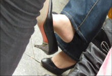 Black jacket and dangling legs